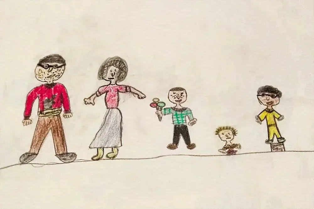 A crayon drawing of a family, made as a child